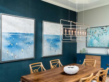 Dining room with decorative art and contemporary chandelier