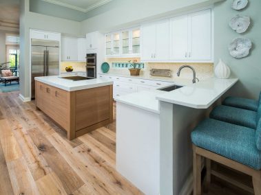A fully-furnished open kitchen with an island