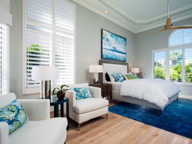 Master bedroom with lounge seating and an open view of the outdoors